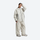 Women's breathable ski jacket set - cream jacket with cream pants, front view with hand on head, for resort and street wear