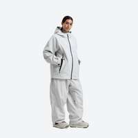 
                  
                    Women's waterproof 2L snow jacket and pants - light gray jacket with light gray pants, for cold-weather winter sports
                  
                