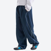 
                  
                    Breathable knit trail pants with cuffed hem - navy knit cargo pants with white top, for travel and city walks
                  
                