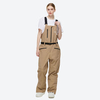 
                  
                    Waterproof 2L snow jacket and bib pants set - tan bib pants, on-model three-quarter front view, for powder and piste riding
                  
                
