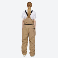 
                  
                    Breathable 2-layer ski jacket with suspender pants - tan bib pants, on-model back view, for cold-weather winter sports
                  
                