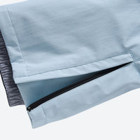 
                  
                    Waterproof 2L snow jacket and bib pants set - light blue bib pants, hem zip close-up detail, for skiing and snowboarding
                  
                