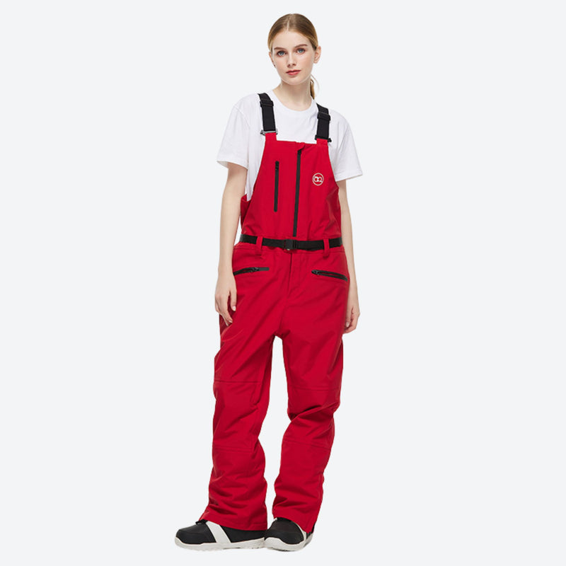 Waterproof 2L snow jacket and bib pants set - red bib pants, on-model three-quarter front view, for powder and piste riding