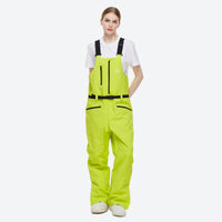 
                  
                    Waterproof 2L snow jacket and bib pants set - lime green bib pants, on-model front view, for powder and piste riding
                  
                