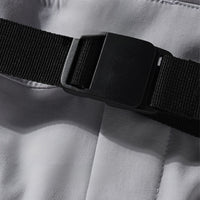 
                  
                    Women's 2-layer snowboard jacket and pants - lavender, waist belt buckle close-up, for cold-weather winter sports
                  
                