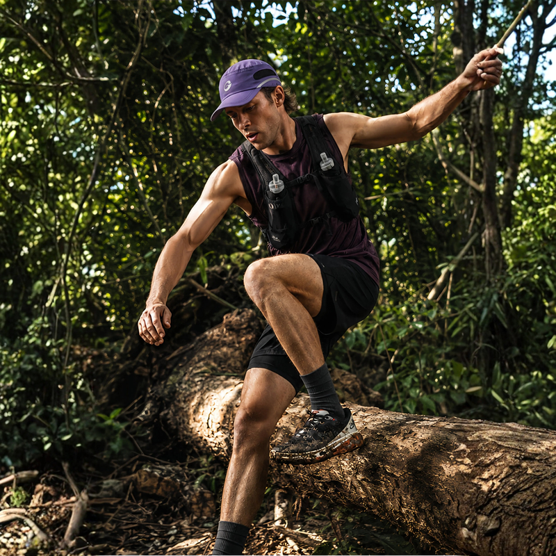 38g trail running cap with sweat absorption - purple featherlight running cap on men jumping trail, action view