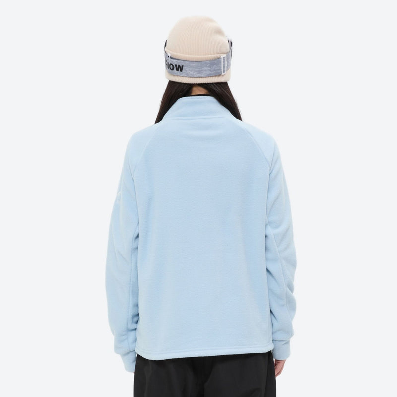Breathable quick-dry fleece liner for layering - light blue fleece liner jacket on women with beanie, back standing view