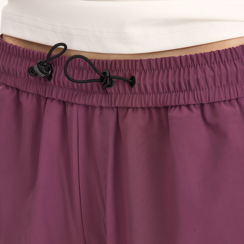 Water-repellent cargo hiking pants with drawcord hem - plum purple wide-leg cargo pants with white tee