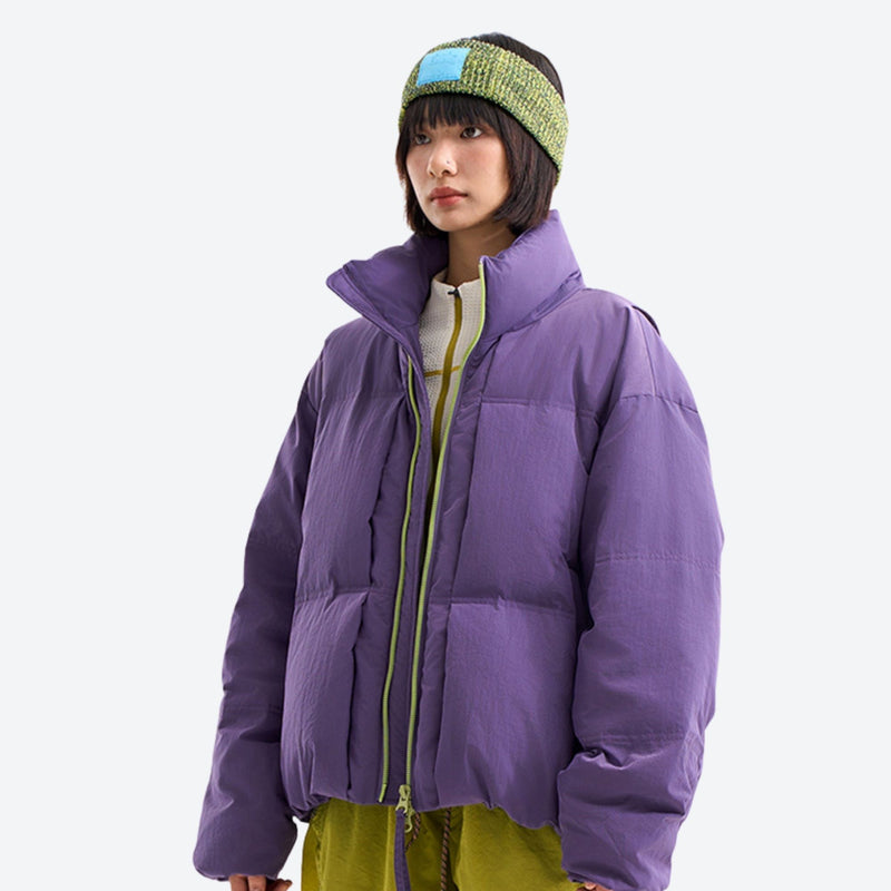 Warm windproof puffer jacket for cold days - purple windproof stand-collar down jacket on women with beanie
