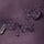 Unisex lightweight softshell outdoor pants - purple, fabric waterproof close-up with water beads, for skiing and snowboarding