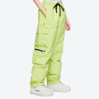 
                  
                    Men's 2-layer snowboard jacket and pants - lime green snow pants, on-model side view, for skiing and snowboarding
                  
                