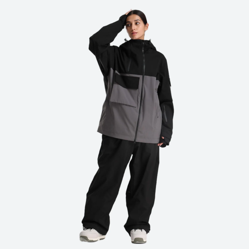 Women's waterproof 2L snow jacket and pants - black and gray colorblock jacket with black pants, front view with hand on head