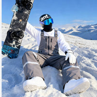
                  
                    Unisex snowboard bib pants - gray bib pants with white top, for resort and street wear
                  
                