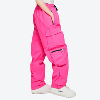 
                  
                    Women's waterproof 2L snow jacket and pants - pink snow pants, on-model side view, for cold-weather winter sports
                  
                