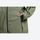 Men's breathable ski jacket with wide-leg pants - olive green, side pocket close-up with hand, for skiing and snowboarding