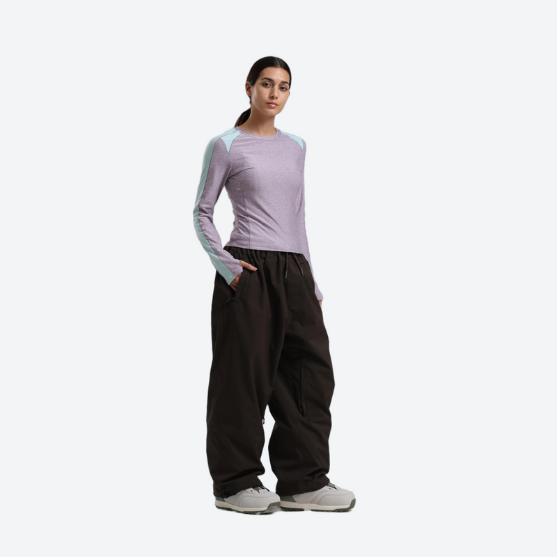 Women's waterproof 2L snow jacket and pants - lavender base layer top with black snow pants, for skiing and snowboarding