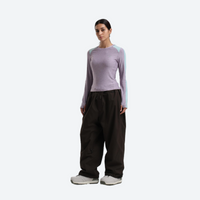 
                  
                    Women's breathable ski jacket set - lavender base layer top with black snow pants, for powder days and winter commute
                  
                