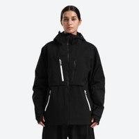 
                  
                    Women's breathable ski jacket with chest zip pockets - black jacket, on-model front view, for resort and street wear
                  
                