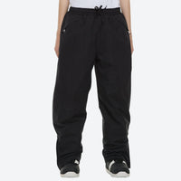 
                  
                    Unisex waterproof 2L snow jacket and pants - black snow pants, on-model front view, for skiing and snowboarding
                  
                