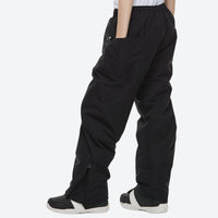 
                  
                    Unisex 2-layer snowboard jacket and pants - black snow pants, on-model side view, for powder days and winter commute
                  
                