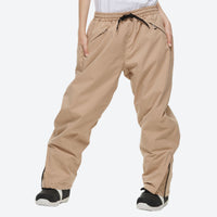 
                  
                    Unisex waterproof 2L snow jacket and pants - tan snow pants, on-model three-quarter front view, for resort and street wear
                  
                