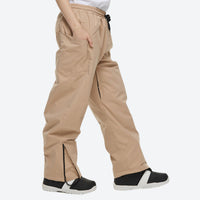 
                  
                    Unisex 2-layer snowboard jacket and pants - tan snow pants, on-model walking three-quarter view, for skiing and snowboarding
                  
                