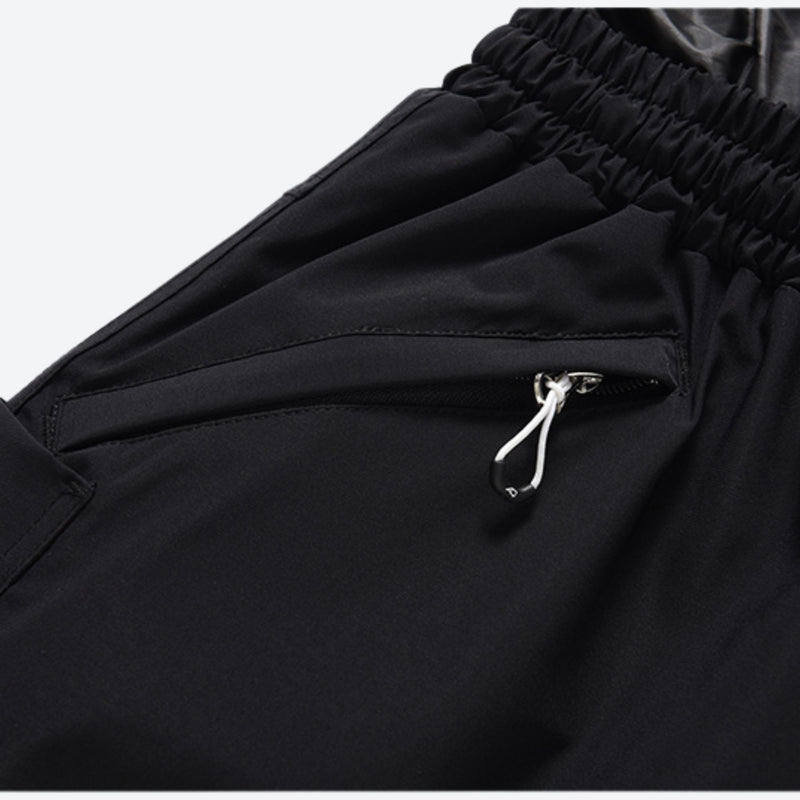 Unisex waterproof 2L snow jacket and pants - black snow pants, zip pocket close-up detail, for powder days and winter commute