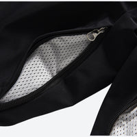 
                  
                    Unisex 2-layer snowboard jacket and pants - black snow pants, thigh zip vent mesh close-up detail, for resort and street wear
                  
                
