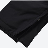 
                  
                    Unisex 2-layer snowboard jacket and pants - black snow pants, hem zip vent close-up detail, for skiing and snowboarding
                  
                