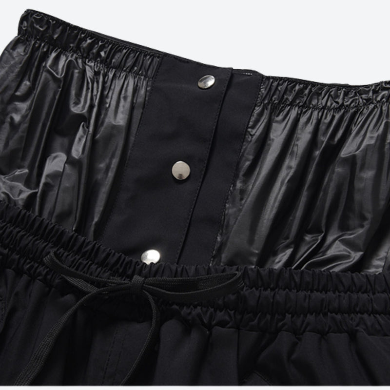 Unisex waterproof 2L snow jacket and pants - black snow pants, waistband snap close-up detail, for cold-weather winter sports