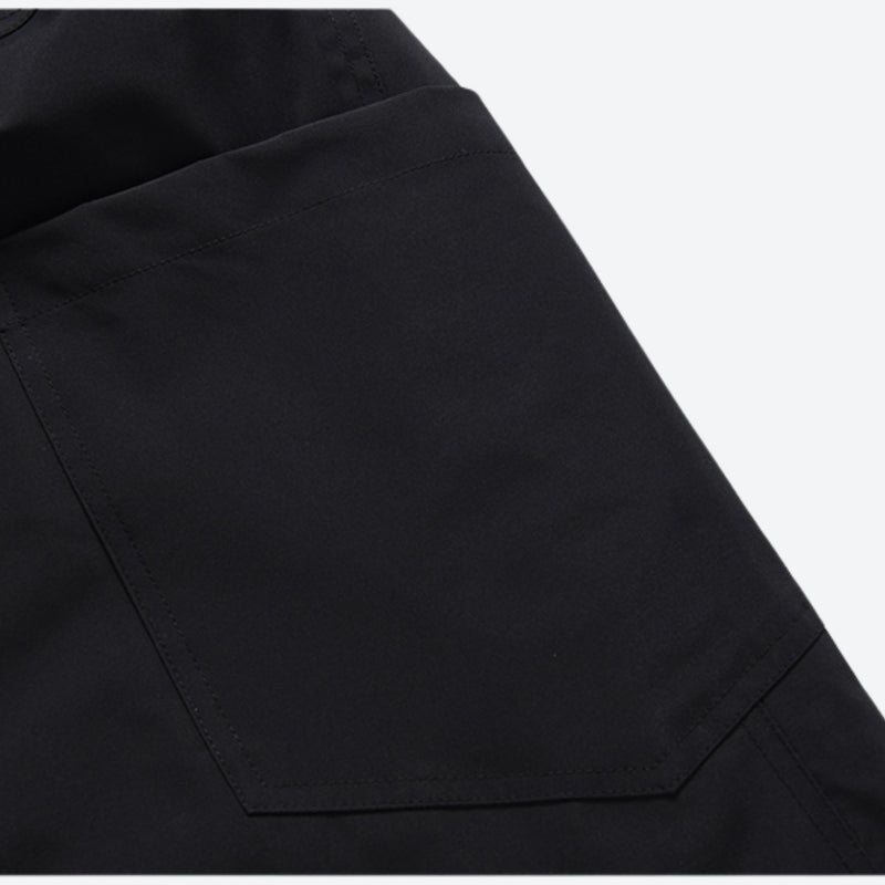 Breathable anorak ski jacket in candy colors - black snow pants, panel seam close-up detail, for cold-weather winter sports
