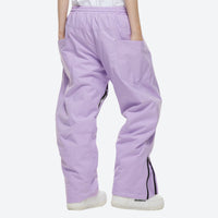 
                  
                    Unisex 2-layer snowboard jacket and pants - lavender snow pants, on-model back view, for resort and street wear
                  
                