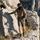 Merino wool multifunctional facemask with 3A antibacterial - black merino wool neckwarmer on men climbing, worn action view