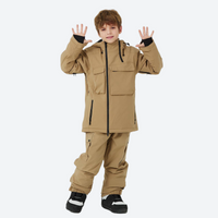 
                  
                    Kids snowboard jacket and pants with snow gaiters - tan kids jacket with tan pants, for kids skiing and snowboarding
                  
                