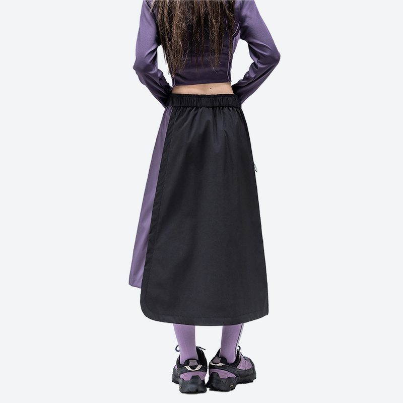 Water-repellent color-block long skirt PFOS PFOA free - black purple color-block long skirt on women, back standing view