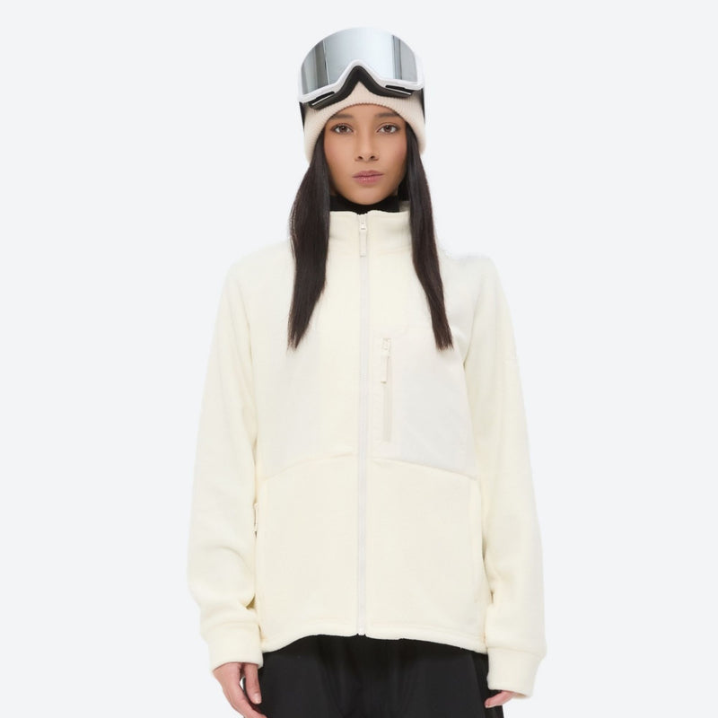 Breathable quick-dry fleece liner for layering - cream fleece liner jacket on women with goggles, front standing view