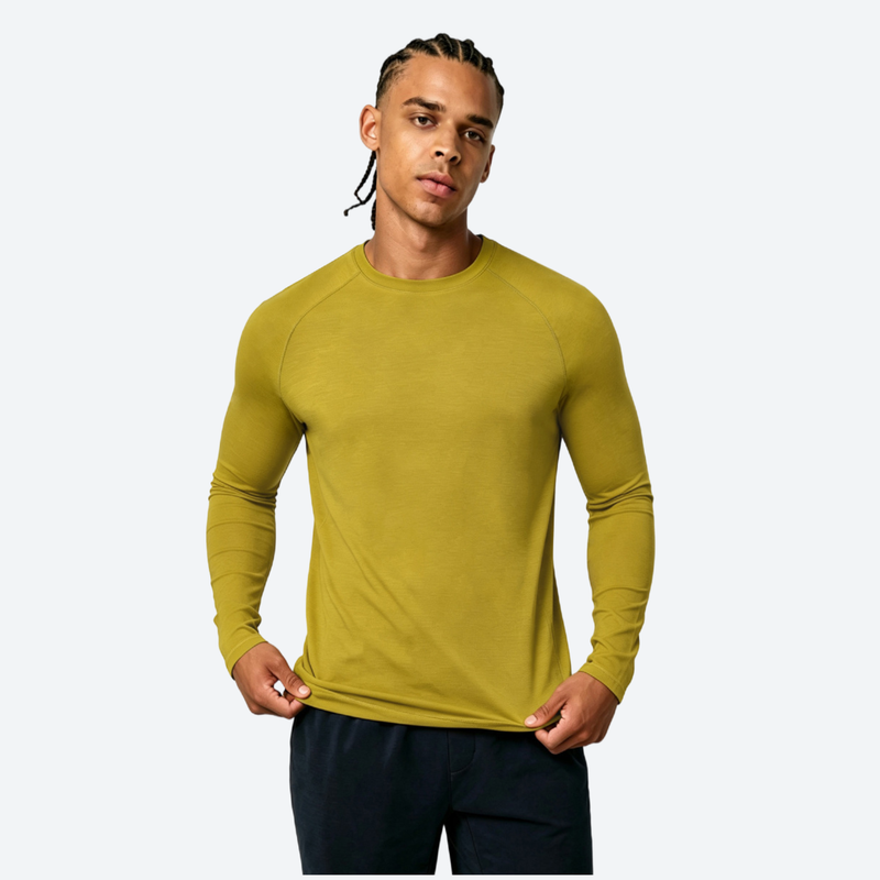 Men's merino wool quick-dry base layer top - yellow merino wool quick-dry base layer top on men, front standing view