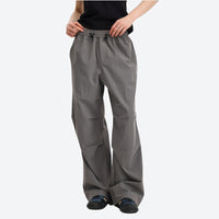 
                  
                    Unisex UPF50 water-repellent cargo pants - gray wide-leg cargo pants with black tee, for travel and daily commute
                  
                