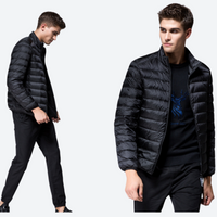 
                  
                    Men's lightweight waterproof down midlayer for cold days - black ultra-light down jacket on men
                  
                