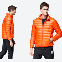 
                  
                    Men's ultra-light compact down mid-layer jacket - orange ultra-light down jacket on men, for camping and outdoor weekends
                  
                