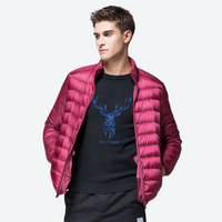 
                  
                    Men's lightweight waterproof down midlayer for cold days - magenta ultra-light down jacket on men, front standing view
                  
                