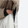 Women's colorblock ski jacket set - tan and cream, front zip close-up with hand, for resort and street wear