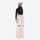 Women's 2-layer snowboard jacket and pants - pink snow pants with black top, on-model side view, for skiing and snowboarding