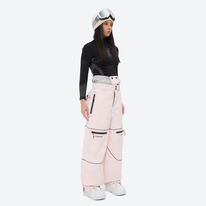 Women's 2-layer snowboard jacket and pants - pink snow pants with black top, on-model side view, for skiing and snowboarding