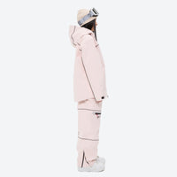 
                  
                    Women's waterproof 2L snow jacket and pants - pink jacket with pink pants, on-model side view, for cold-weather winter sports
                  
                