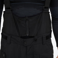 
                  
                    Men's 2-layer snowboard jacket and bib pants - black snow pants, waistband close-up detail, for resort and backcountry days
                  
                