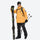 Men's waterproof 2L snow jacket and suspender pants - orange jacket with black pants, for resort and backcountry days