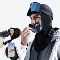 
                  
                    Aurus Mag-Tech facemask neckwarmer for snow sports - black mag-tech facemask on men with blue goggles, for resort ski days
                  
                