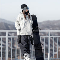 
                  
                    All-mountain true twin snowboard - rider in white jacket, holding board at railing, for all-mountain snowboarding
                  
                