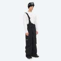 
                  
                    Men's waterproof 3L bib snow pants - black bib snow pants with gray top, for cold-weather winter sports
                  
                